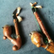 Pair of wooden pipes with carved deer on the front for sale in Plumstead